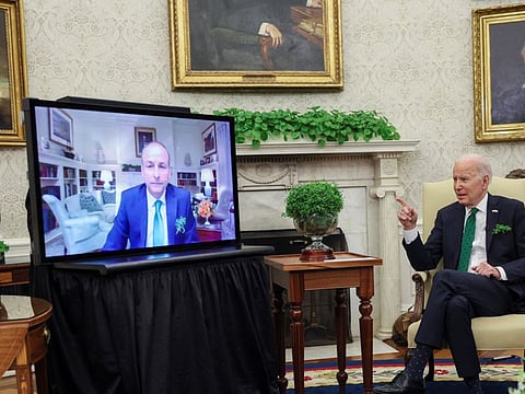 US President Joe Biden speaks while hosting a virtual St. Patrick's Day meeting with Ireland's Prime Minister Micheal Martin after Irish Taoiseach Martin tested positive after arriving in Washington, in the Oval Office at the White House in Washington, on March 17, 2022. 