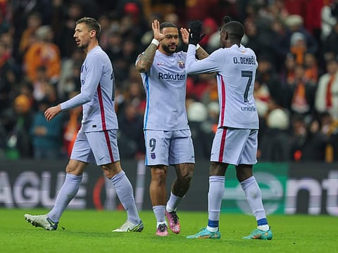 Barcelona's Ousmane Dembele (right) and Memphis Depay (centre) celebrate at the end of the Europa League round of 16 second leg match against Galatasaray in Istanbul, Turkey. They have been drawn to face Frankfurt in the quarters.