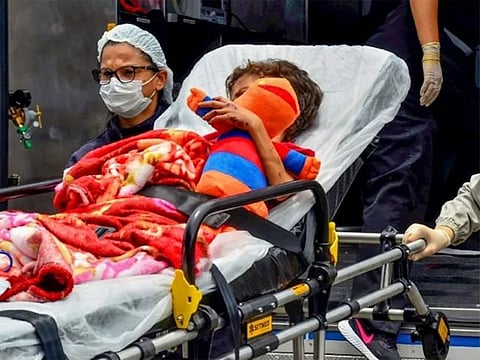 Glauco, 7, arrives at a hospital in Manaus, Brazil, on March 17, 2022, after being lost with his brother in the Amazon rainforest for 25 days 