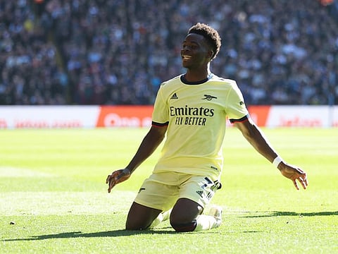 Arsenal's Bukayo Saka celebrates scoring against Aston Villa at Villa Park in the Premier League clash.