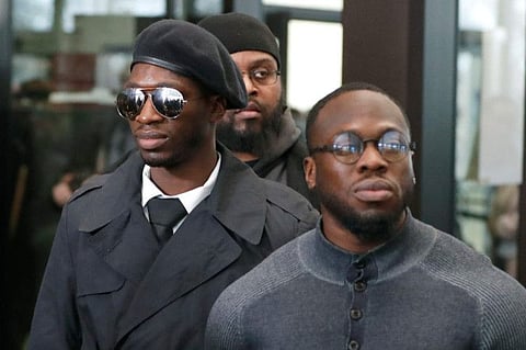 Brothers Olabinjo Osundairo, right, and Abimbola Osundairo, appear outside the Leighton Criminal Courthouse in Chicago, February 24, 2020.