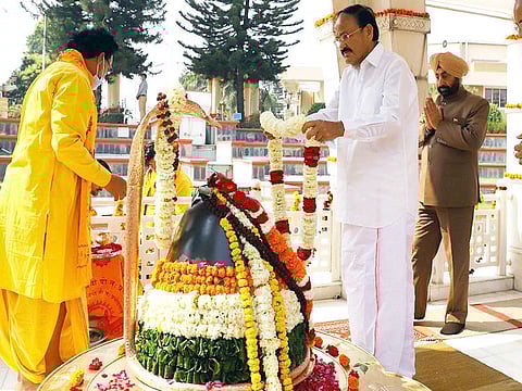 India's Vice-President M Venkaiah Naidu lays a garland on Shivlinga while offering prayers at the inauguration of South Asian Institute of Peace and Reconciliation at the Dev Sanskriti Vishwa Vidyalaya, in Haridwar on Saturday. 