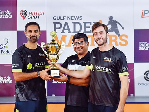 Sachin Talwar and Sergio Berrocal from Oxygen Padel, who won the men’s doubles title, receives the trophy from Anshuman R. Joshi, Director - Sales & Publishing, during the presentation of the Gulf News Panel Masters at World Panel Academy at Al Qouz on Saturday.