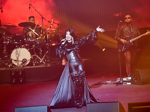 Filipino singer Gigi De Lana and her band performing in Abu Dhabi.
