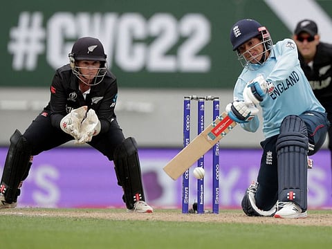 Englands Sophia Dunkley plays a shot watched by New Zealands wicketkeeper Katey Martin during the 2022 Women's Cricket World Cup match at Eden Park in Auckland.