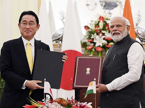 Prime Minister Narendra Modi and Japanese Prime Minister Fumio Kishida exchange agreements during the 14th India-Japan Annual Summit, in New Delhi on Saturday. 