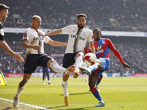 Everton's Richarlison and Andros Townsend in action with Crystal Palace's Tyrick Mitchell.