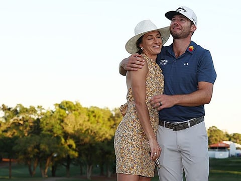 Sam Burns celebrates with his wife Caroline Campbell after defeating Davis Riley in a playoff in the final round of the Valspar Championship 