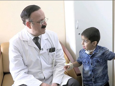 Dr Jamal Kassouma, Consultant ENT Surgeon at Dubai Hospital who performed the surgery, with the boy