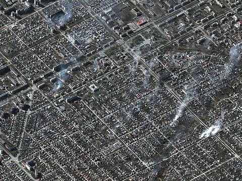 A satellite image shows an overview of burning buildings in Livoberezhnyi district, Mariupol, on March 22, 2022.  