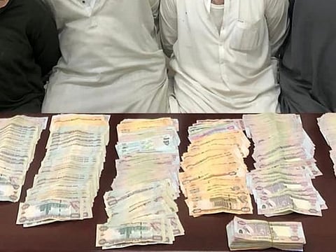 Gang members with the stolen cash. 