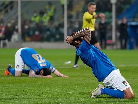 Italy's Joao Pedro reacts after missing a scoring chance in the World Cup qualifying play-off match between Italy and North Macedonia, at Renzo Barbera stadium, in Palermo, Italy, Thursday, March 24, 2022. North Macedonia won 1-0. 