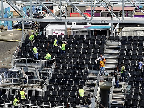 Overview of the new track in Jeddah, workers clean the seat shells on the grandstand.