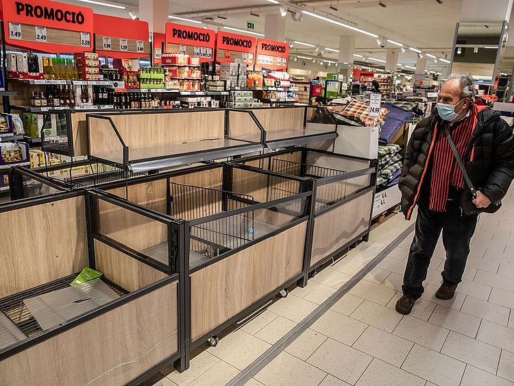 Empty product display units inside a supermarket in Barcelona