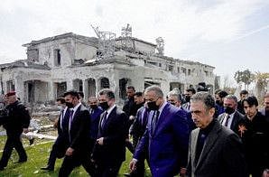 A handout picture released by the Iraqi Prime Minister's Media Office shows Premier Mustafa Al Kadhemi and Prime Minister of the Regional Government of Iraqi Kurdistan Masrour Barzani (3rd R) visiting the site of a missile attack a day earlier in Erbil, on March 14, 2022. 