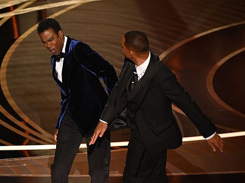 US actor Will Smith (R) slaps US actor Chris Rock onstage during the 94th Oscars at the Dolby Theatre in Hollywood, California on March 27, 2022.