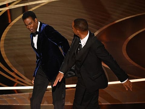 US actor Will Smith (R) slaps US actor Chris Rock onstage during the 94th Oscars at the Dolby Theatre in Hollywood, California on March 27, 2022.
