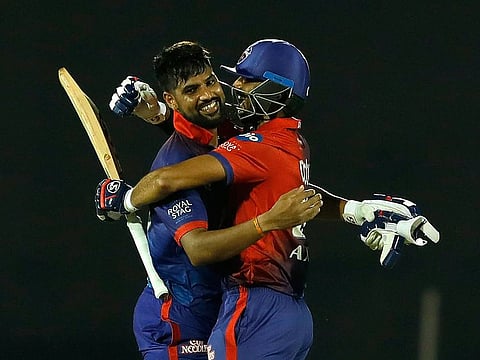 Lalit Yadav and Axar Patel of the Delhi Capitals celebrate after beating the Mumbai Indians in the Indian Premier League 2022 at the Brabourne Stadium in Mumbai on March 27, 2022.