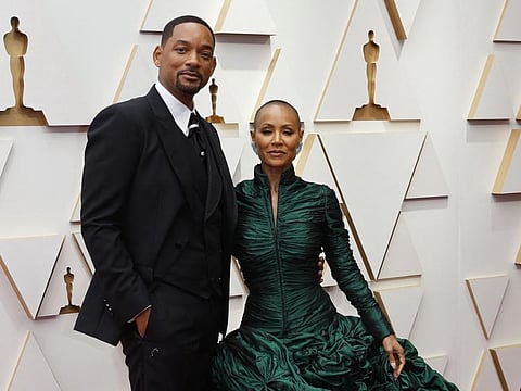 Will Smith and Jada Pinkett Smith pose on the red carpet during the Oscars arrivals at the 94th Academy Awards in Hollywood, Los Angeles, California, U.S., March 27, 2022.