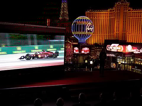 A screen show Charles Leclerc driving a Ferrari, during a news conference announcing a 2023 Formula One Grand Prix auto race to be held in Las Vegas, in Las Vegas.