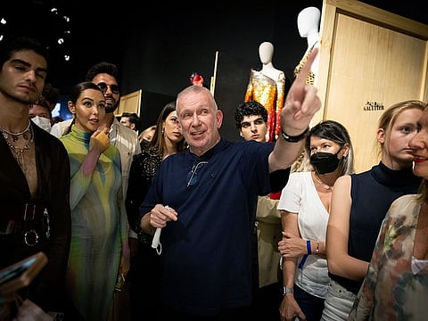 Jean Paul Gaultier took an excited crowd around his Dubai exhibition by Thierry-Maxime Loriot at the France Pavilion. We speak to JPG himself and his muses.