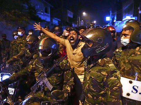 A Sri Lankan man shouts anti government slogans during a protest outside Sri Lankan president's private residence on the outskirts of Colombo. 