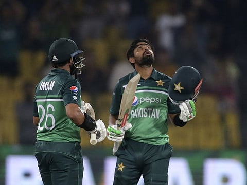 Pakistan's Babar Azam (right) celebrates after his century during the third one day international cricket match between Pakistan and Australia at Gaddafi Stadium in Lahore, Pakistan.