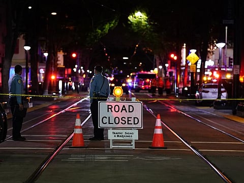 A roadblock is set a block away from the scene of an apparent mass shooting in Sacramento on April 3, 2022. 
