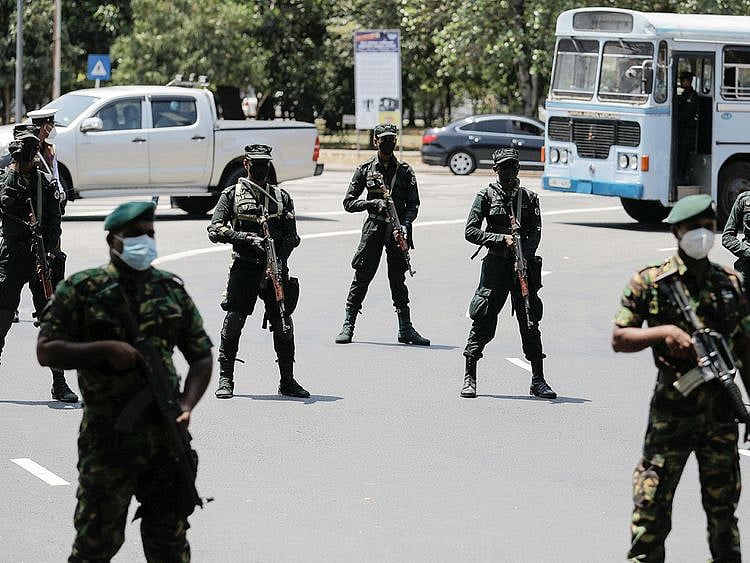 Sri Lankan army soldiers stand guard 