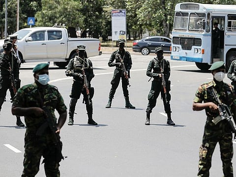 Sri Lankan army soldiers stand guard near the Independence Square as opposition alliance protest after the government imposed a curfew, amid the country's economic crisis, in Colombo, Sri Lanka April 3, 2022