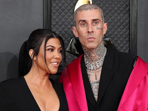 Kourtney Kardashian and Travis Barker pose on the red carpet at the 64th Annual Grammy Awards at the MGM Grand Garden Arena in Las Vegas, Nevada, U.S., April 3, 2022.