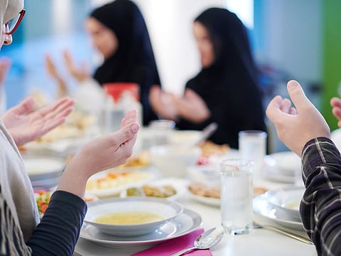 Muslims saying a prayer before iftar, the meal taken at sunset to end the day's fast. [Picture for illustrative purpose only]