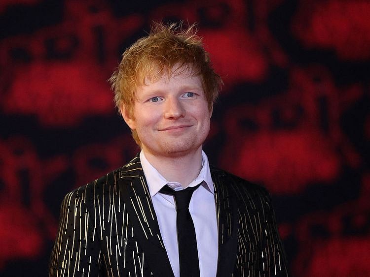 In this file photo taken on November 20, 2021 British singer Edward Christopher Sheeran aka 'Ed Sheeran' poses on the red carpet prior the 23st NRJ Music Awards ceremony at the Palais des Festivals in Cannes, south-eastern France