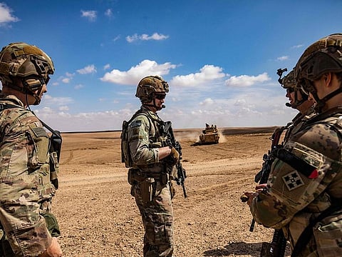  Troops from the Syrian Democratic Forces (SDF) Special Operations and the US-led anti-terrorist coalition, take part in heavy-weaponry military exercises in the countryside of Deir Ezzor in northeastern Syria, on March 25, 2022. 