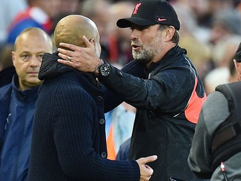 Manchester City manager Pep Guardiola with Liverpool manager Juergen Klopp.