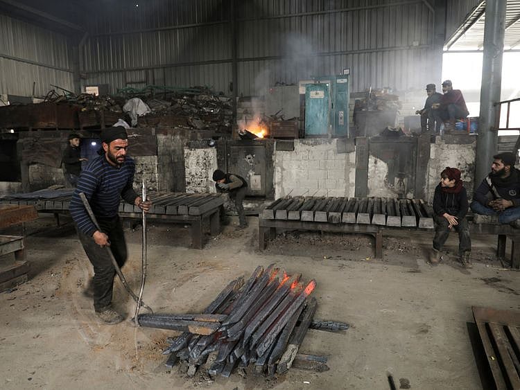 Copy of 2022-04-11T112149Z_707974489_RC2RZS9EOE57_RTRMADP_3_SYRIA-SECURITY-INDUSTRY-1649676983005