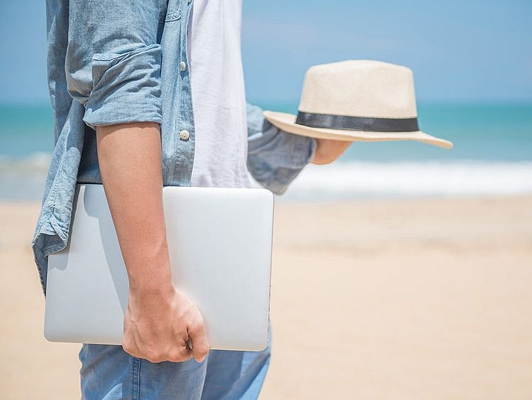 Digital nomad toxic productivity beach work travel