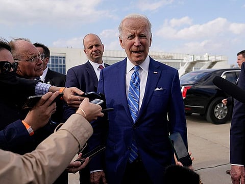 US President Joe Biden speaks to reporters before boarding Air Force One at Des Moines International Airport, in Des Moines Iowa, Tuesday, April 12, 2022.