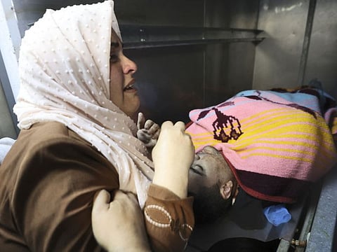 A Palestinians woman mourns the death of Mohammad Hassan Mohammad Assaf, 34, who was shot dead by Israel in the city of Nablus, on the fifth day of military operations in the occupied West Bank, on April 13, 2022.