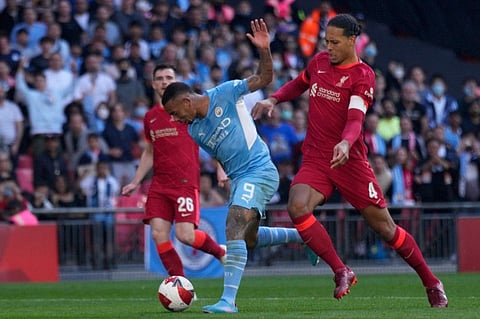 Liverpool's Virgil van Dijk (right) vies for the ball with Manchester City's Gabriel Jesus during the English FA Cup semifinal at Wembley stadium in London.