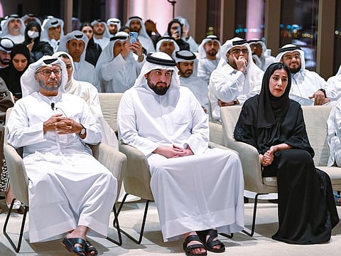 Sheikh Ahmed (centre) with Dr. Anwar Gargash and Mona Al Marri at the Emirati Media Forum in 2022.