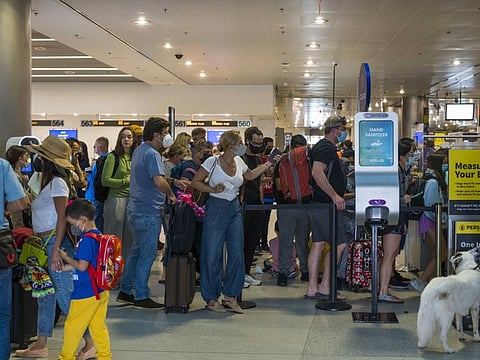 Travellers at the departures concourse of Miami International Airport (MIA) in  Florida, US, on April 18, 2022. A federal judge in Florida has voided the national mask mandate covering airplanes and other public transportation as exceeding the authority of US health officials in the pandemic.