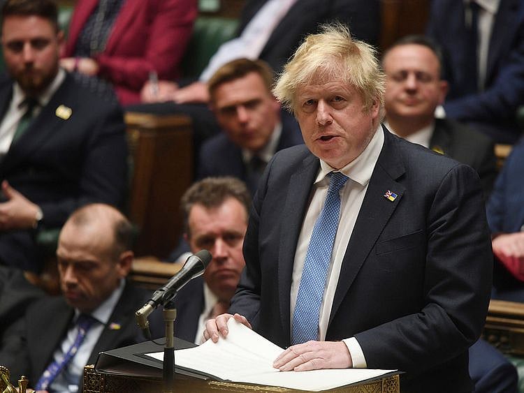 Britain's Prime Minister Boris Johnson speaks in the House of Commons in London, on April 19, 2022. Johnson has offered what he said is a ”wholehearted” apology for attending illegal party during lockdown. But Johnson said Tuesday that he didn't knowingly break rules or mislead Parliament. Johnson told lawmakers in the House of Commons that it simply “did not occur" to him that the gathering was a party.   