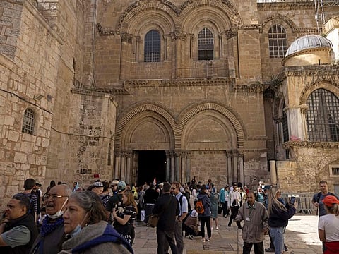 Christian pilgrims visit the Church of the Holy Sepulchre in Jerusalem's Old City during Holy Week, on April 19, 2022.