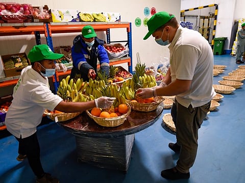 Workers packing fruit baskets  for "One Million Meals from Waste Food" campaign, which joined the efforts of the Billion Meals Initiative to provide food support to the poor and needy. Photo: Virendra Saklani/Gulf News