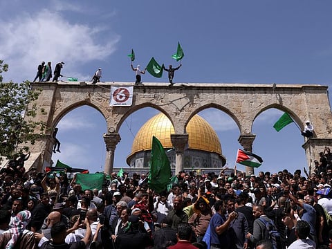 Palestinians protest at the compound that houses Al Aqsa Mosque in Jerusalem's Old City April 22, 2022.  