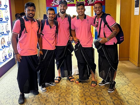 Sanju Samson, Yuzvendra Chahal, Daryl Mitchell, Riyan Parag and Shimron Hetmyer of the Rajasthan Royals pose in lungis on Sunday ahead of their travel to Pune from Mumbai, for the IPL game against the Royal Challengers Bangalore on Tuesday.