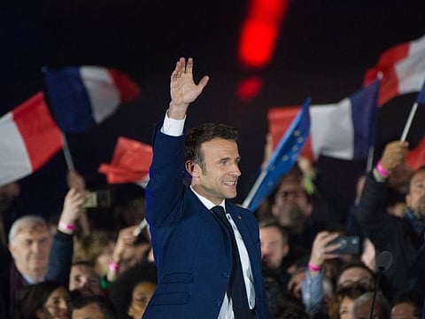 Emmanuel Macron, France's president, waves to supporters following the second round of voting in the French presidential election in Paris, France, on Sunday, April 24, 2022.