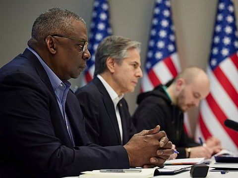 In this image from video provided by the Ukrainian Presidential Press Office on Monday, April 25, 2022, U.S. Secretary of Defense Lloyd Austin, left, and Secretary of State Antony Blinken, centre, attend their meeting with Ukrainian President Volodymyr Zelenskyy, not in the picture, in Kyiv, Ukraine.