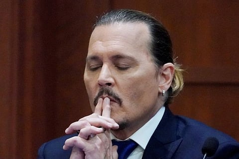Actor Johnny Depp testifies in the courtroom at the Fairfax County Circuit Courthouse in Fairfax, Virginia, U.S.,  April 25, 2022.  Steve Helber/Pool via REUTERS     TPX IMAGES OF THE DAY